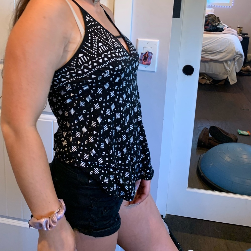 Black shirt with white patterns on it